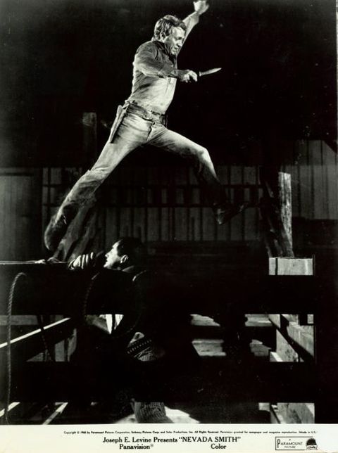 Max (McQueen) leaps over his 
enemy (played by Martin Landau), 
with knife in hand.